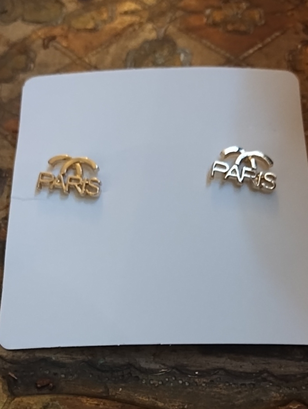 Gold Tone Paris Logo Stud Earrings